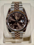 This exquisite timepiece comes new from AD. Timepiece was only sized at AD before being re boxed. Chocolate diamond dial remains one of the most sought after Datejust on the market.